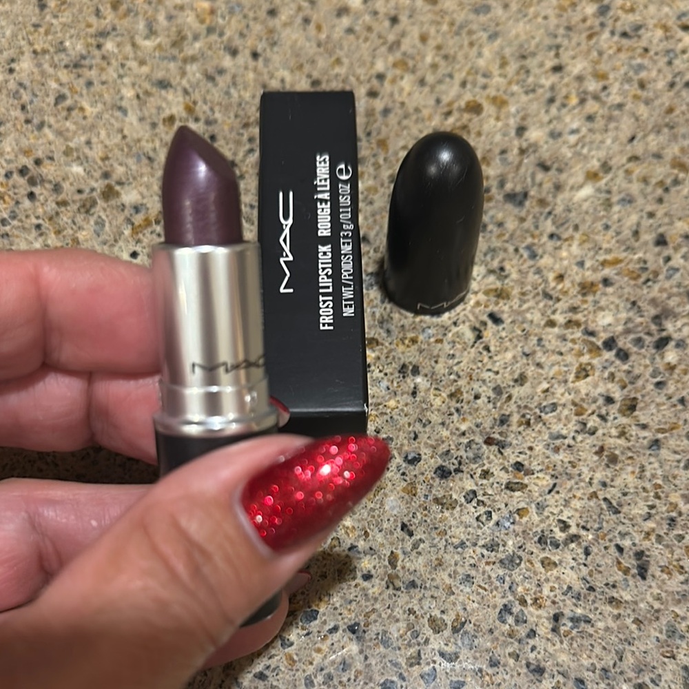 MAC frost lipstick in the shade Dominate.